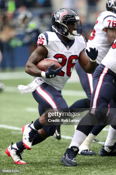 Lamar Miller of the Houston Texans runs with the ball during the game against the Seattle Seahawks at CenturyLink Field on October 29, 2017 in...