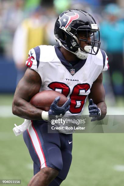 Lamar Miller of the Houston Texans runs with the ball during the game against the Seattle Seahawks at CenturyLink Field on October 29, 2017 in...