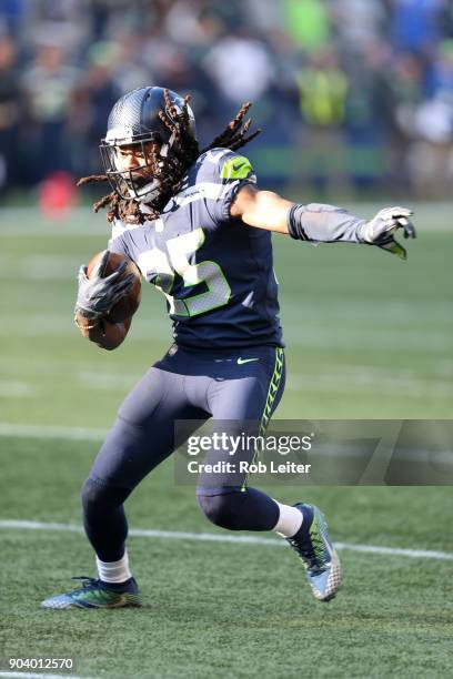 Richard Sherman of the Seattle Seahawks returns an interception during the game against the Houston Texans at CenturyLink Field on October 29, 2017...