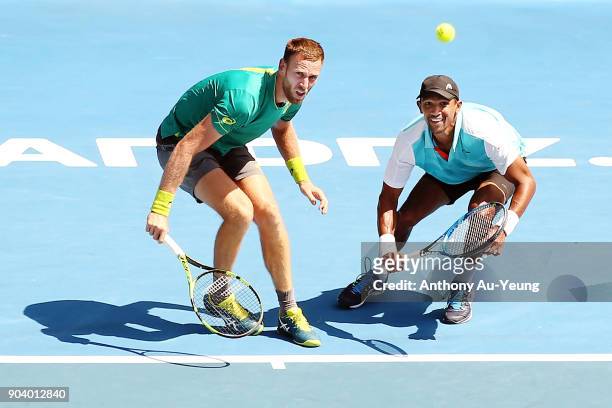 Michael Venus of New Zealand and Raven Klaasen of South Africa play a shot in their doubles semi final match against Max Mirnyi of Belarus and...