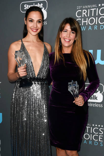 Actor Gal Gadot and director Patty Jenkins pose with the See Her Award and Best Action Movie award for 'Wonder Woman' during The 23rd Annual Critics'...