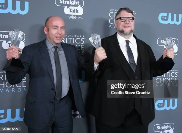 Miles Dale and Guillermo Del Toro pose with the 'Best Director' and 'Best Picture' awards for 'The Shape of Water' in the press room during The 23rd...