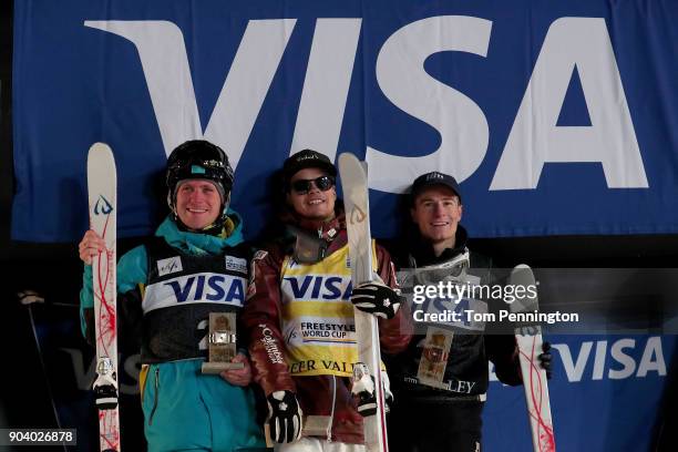 Dmitriy Reikherd of Kazakhstan in second place, Mikael Kingsbury of Canada in first place and Matt Graham of Australia in third place celebrate on...