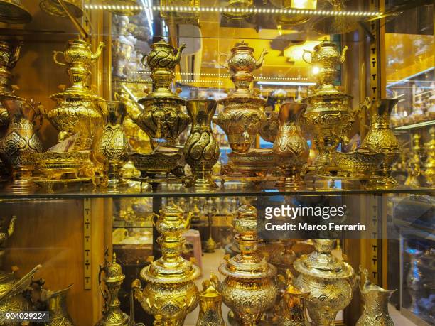 gold plated samovars for sale at grand bazaar of isfahan, iran - samovar stock pictures, royalty-free photos & images