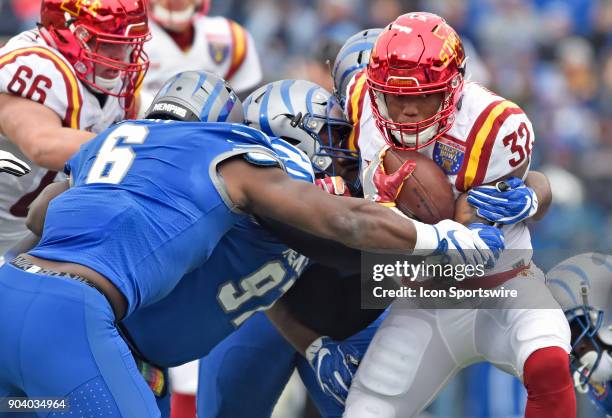 Memphis, TN Iowa State Cyclones running back David Montgomery tries to break free of two Memphis Tigers defenders during the first quarter of a NCAA...