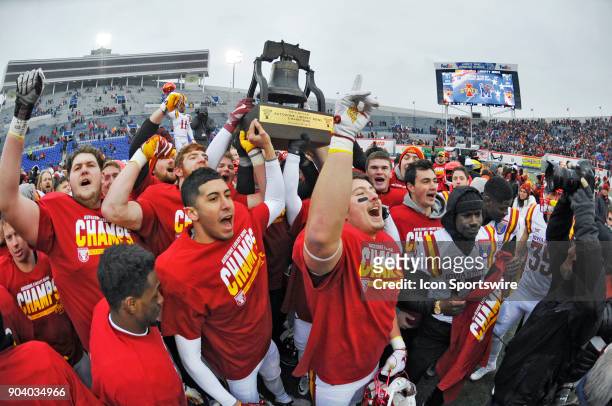 Memphis, TN Iowa State Cyclones players celebrate with the Liberty Bowl trophy after winning a NCAA college football game against the Memphis Tigers...