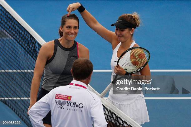 Andrea Petkovic of Germany has a dance with Belinda Bencic of Switzerland whilst rain breaks play in the WOmen's SIngles Final during day four of the...