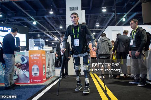 Steven Sanchez, test pilot for U.S. Bionics Inc.'s SuitX, demonstrates the company's Phoenix exoskeleton during the 2018 Consumer Electronics Show in...
