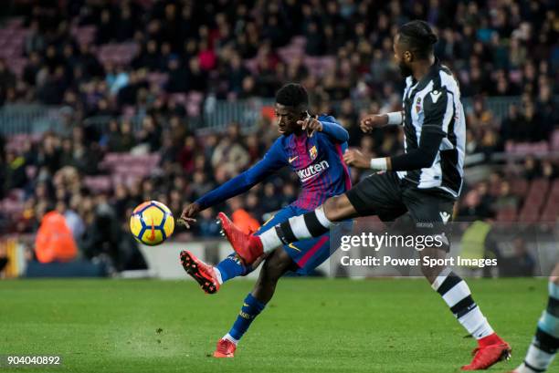 Ousmane Dembele of FC Barcelona fights for the ball with Cheik Doukoure of Levante UD during the La Liga 2017-18 match between FC Barcelona and...