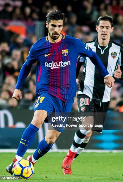 Andre Filipe Tavares Gomes of FC Barcelona is followed by Sasa Lukic of Levante UD during the La Liga 2017-18 match between FC Barcelona and Levante...