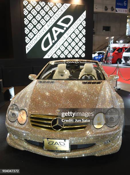 Fully Swarovski covered Mercedes displayed at GARSON booth during Tokyo Auto Salon 2018 at Makuhari Messe on January 12, 2018 in Chiba, Japan.