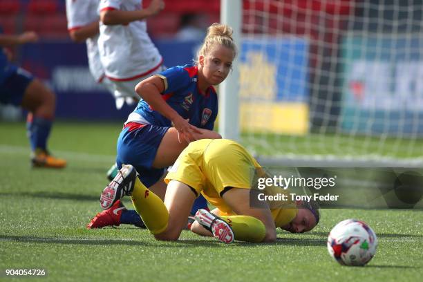 Hannah Brewer of the Jets contests the ball with Sarah Willacy of Adelaide during the round 11 W-League match between the Newcastle Jets and Adelaide...