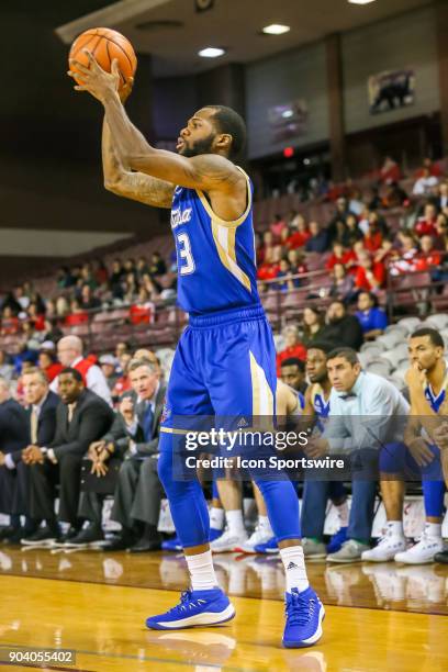 Tulsa Golden Hurricane guard Elijah Joiner throws a three-point shot during the basketball game between the Tulsa Golden Hurricane and Houston...