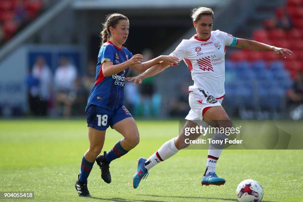 Clare Wheeler of the Jets and Grace Abbey of Adelaide contest the ball during the round 11 W-League match between the Newcastle Jets and Adelaide...