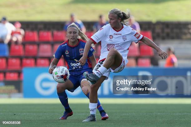 Gema Simon of the Jets contests the ball against Grace Abbey of Adelaide United during the round 11 W-League match between the Newcastle Jets and...