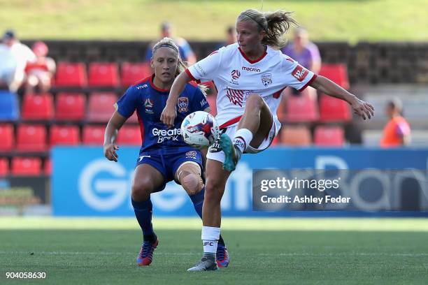 Gema Simon of the Jets contests the ball against Grace Abbey of Adelaide United during the round 11 W-League match between the Newcastle Jets and...