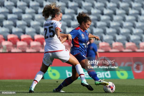 Katherine Stengal of the Jets controls the ball ahead of Kathleen Naughton of Adelaide United during the round 11 W-League match between the...
