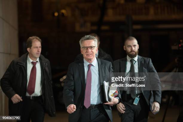 German Interior Minister Thomas de Maiziere arrives after a break at the headquarters of the German Social Democrats where preliminary coalition...
