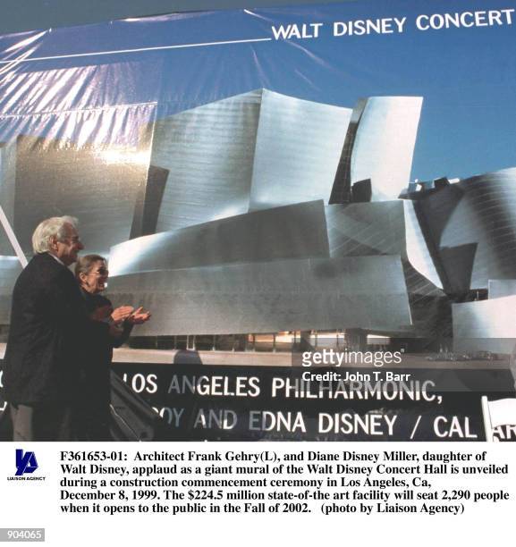 Architect Frank Gehry, and Diane Disney Miller, daughter of Walt Disney, applaud as a giant mural of the Walt Disney Concert Hall is unveiled during...