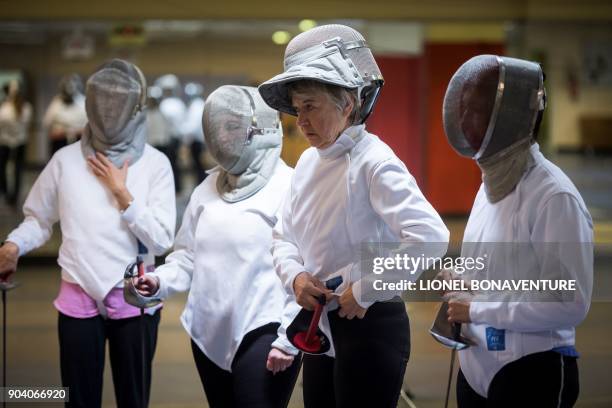 Women participate in a fencing training session organised by the association "Stop aux violences sexuelles" and the French Fencing Federation on...