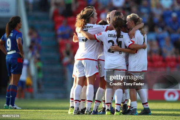 Adelaide players celebrate after the win over the Jets during the round 11 W-League match between the Newcastle Jets and Adelaide United at McDonald...