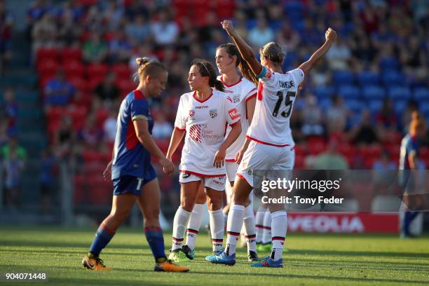 Adelaide players celebrate after the win over the Jets during the round 11 W-League match between the Newcastle Jets and Adelaide United at McDonald...