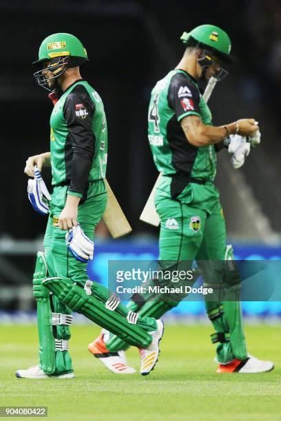 Ben Dunk of the Stars looks dejected after being dismissed as teammate Kevin Pietersen of the Stars walks on during the Big Bash League match between...