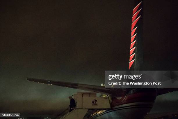 President-elect Donald Trump disembarks his plane as he makes his way to a "USA Thank You Tour 2016" event in the Crown Coliseum, in Raleigh, NC on...