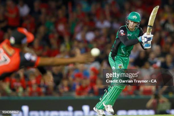 Dwayne Bravo of the Melbourne Renegades dives for a catch off Peter Handscomb of the Melbourne Stars during the Big Bash League match between the...