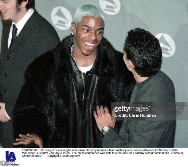 Singer Sisqo laughs with fellow Grammy nominee Marc Anthony at a press conference in Webster Hall in Manhattan, Tuesday, January 4, 2000. The press...