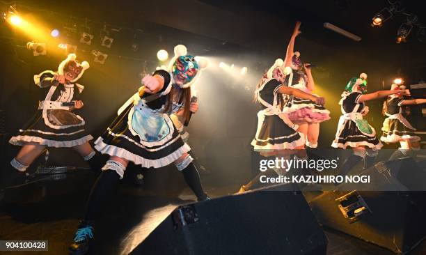 Female idol group Kasotsuka Shojo , produced by Japanese idol agency Cinderella Academy, perform during their live stage show in Tokyo on January 12,...