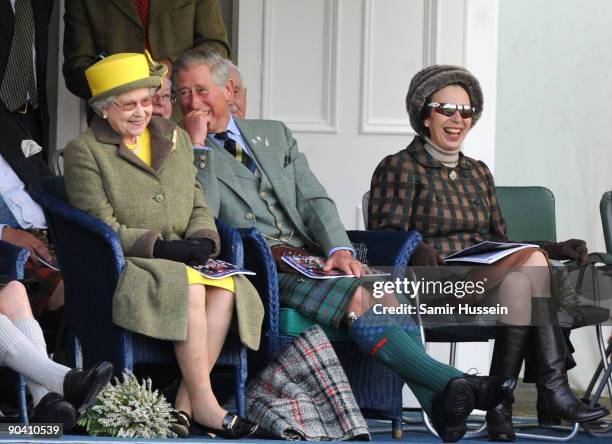 Queen Elizabeth II, Prince Charles, Prince of Wales and Princess Anne, Princess Royal watch the events at the 2009 Braemar Highland Games on...