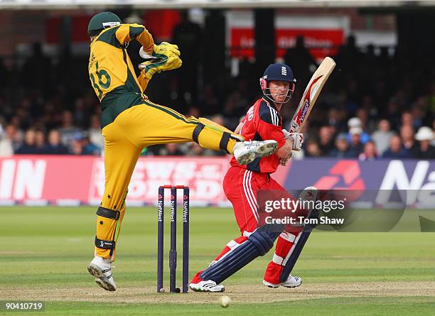 Paul Collingwood of England hits out as Tim Paine of Australia takes evasive action during the 2nd NatWest One Day International between England and...