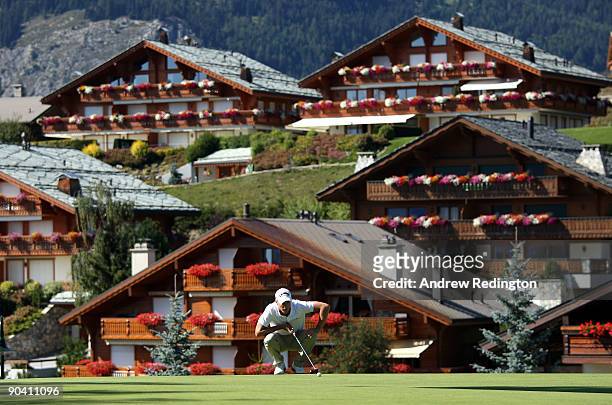 Alexander Noren of Sweden lines up his birdie putt on the 14th hole during the final round of The Omega European Masters at Crans-Sur-Sierre Golf...