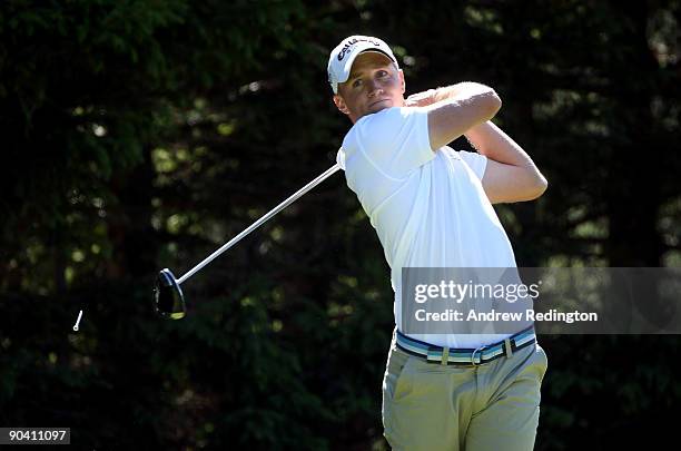 Alexander Noren of Sweden watches his tee-shot on the 15th hole during the final round of The Omega European Masters at Crans-Sur-Sierre Golf Club on...