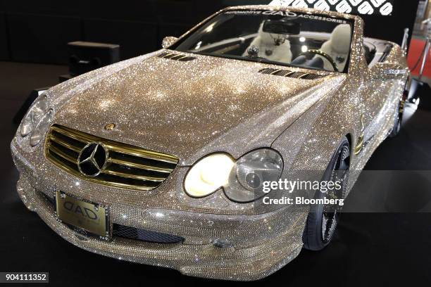 Customized Daimler AG Mercedes-Benz SL600 vehicle decorated with Swarovski crystals stands on display at the Tokyo Auto Salon in Chiba, Japan, on...