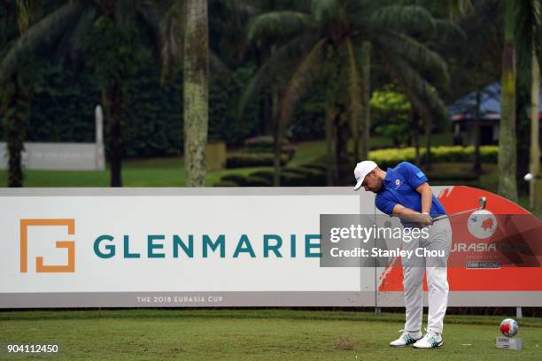 Tyrrell Hatton of team Europe plays a tee shot during the fourballs matches on day one of the 2018 EurAsia Cup presented by DRB-HICOM at Glenmarie...