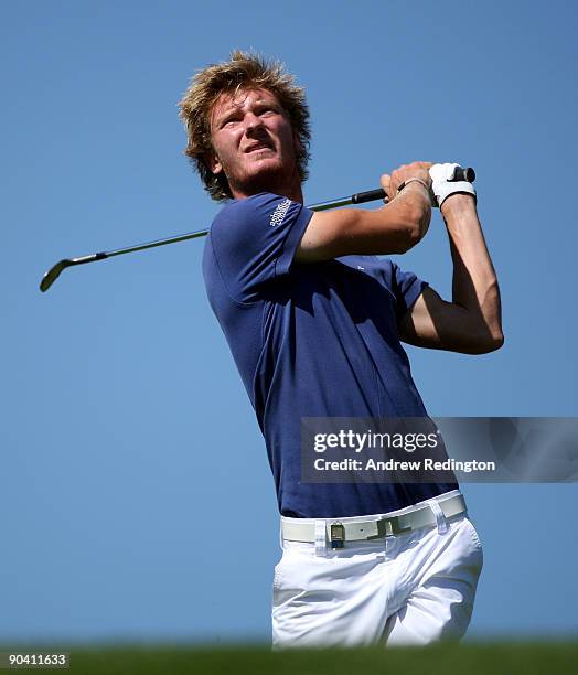 Chris Wood of England watches his second shot on the 12th hole during the final round of The Omega European Masters at Crans-Sur-Sierre Golf Club on...