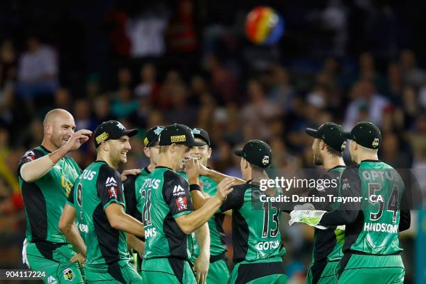 Seb Gotch of the Melbourne Stars celebrates with team mates after taking a catch to dismiss Matt Short of the Melbourne Renegade during the Big Bash...