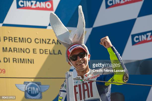 Valentino Rossi of Fiat Yamaha celebrates his victory on the podium after the MotoGP of San Marino on September 6, 2009 in San Marino, Italy.