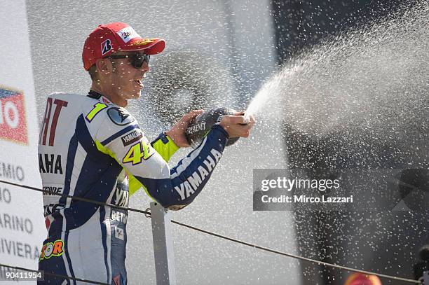 Valentino Rossi of Fiat Yamaha celebrates his victory on the podium after the MotoGP of San Marino on September 6, 2009 in San Marino, Italy.