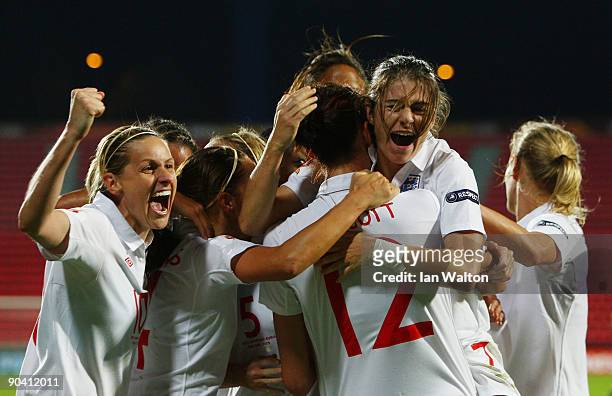 Jill Scott of England is congratulated by team mates after scoring the winning goal during the UEFA Women's Euro 2009 Semi-Final match between...