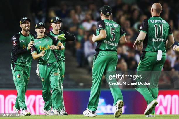 Seb Gotch of the Stars celebrates catch with Glenn Maxwell of the Stars and Peter Handscomb during the Big Bash League match between the Melbourne...