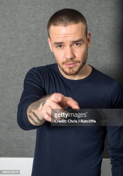 Liam Payne poses for a photograph as Liam Payne and Rita Ora visit KISS FM at Bauer Radio on January 12, 2018 in London, England.