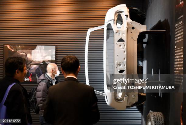 The chassis of the first generation Mazda Roadster, known as MX-5 Miata in the overseas market, is displayed at the Mazda booth's restore section of...