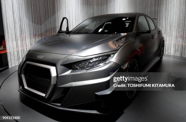 The Mugen RC20GT Civic type-R concept is displayed at the Honda booth of the Tokyo Auto Salon at the Makuhari Messe in Chiba on January 12, 2018. The...