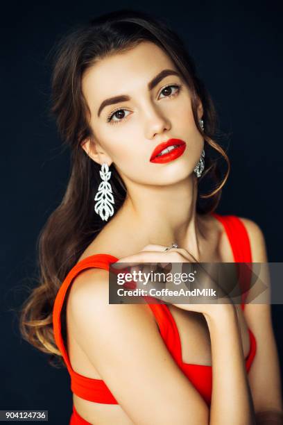 nice looking woman with beautiful earings - red lipstick stock pictures, royalty-free photos & images