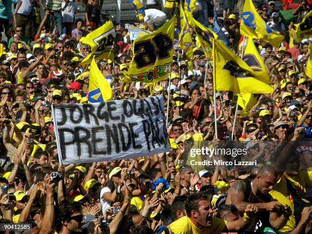 Fans celebrate on the track after the victory of Valentino Rossi of Italy and Fiat Yamaha during the MotoGP of San Marino on September 6, 2009 in San...