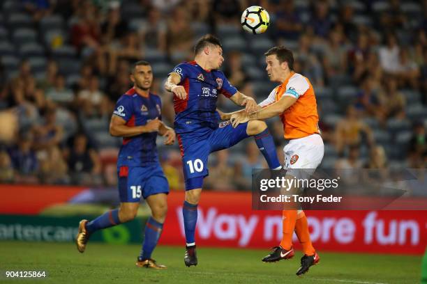 Wayne Brown of the Jets contests the ball with Matthew McKay of the Roar during the round 16 A-League match between the Newcastle Jets and the...