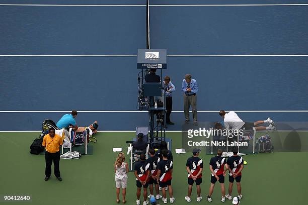 Rafael Nadal of Spain and Nicolas Almagro of Spain are attended to by trainers Michael Novotny and Clay Snitman during day seven of the 2009 U.S....
